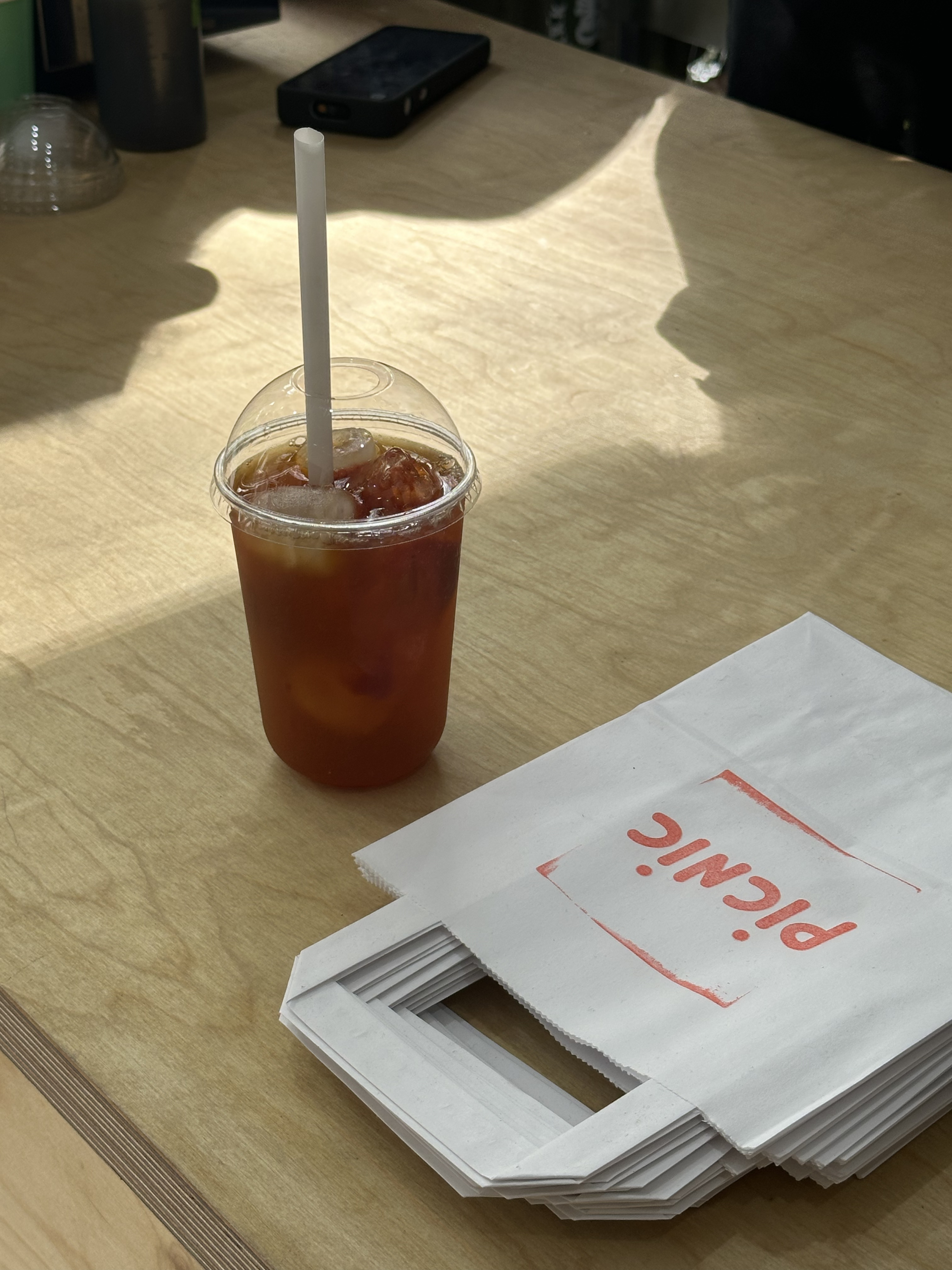 PICNIC iced drink and branded paper bags